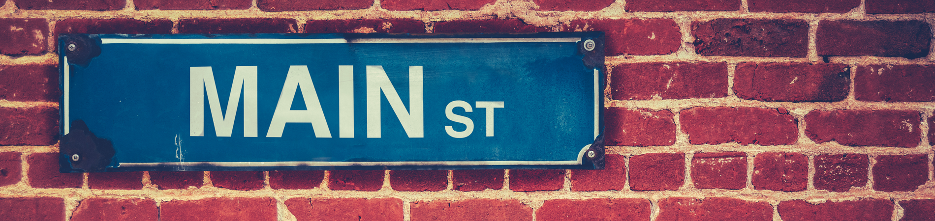 main_street_sign_on_brick_wall